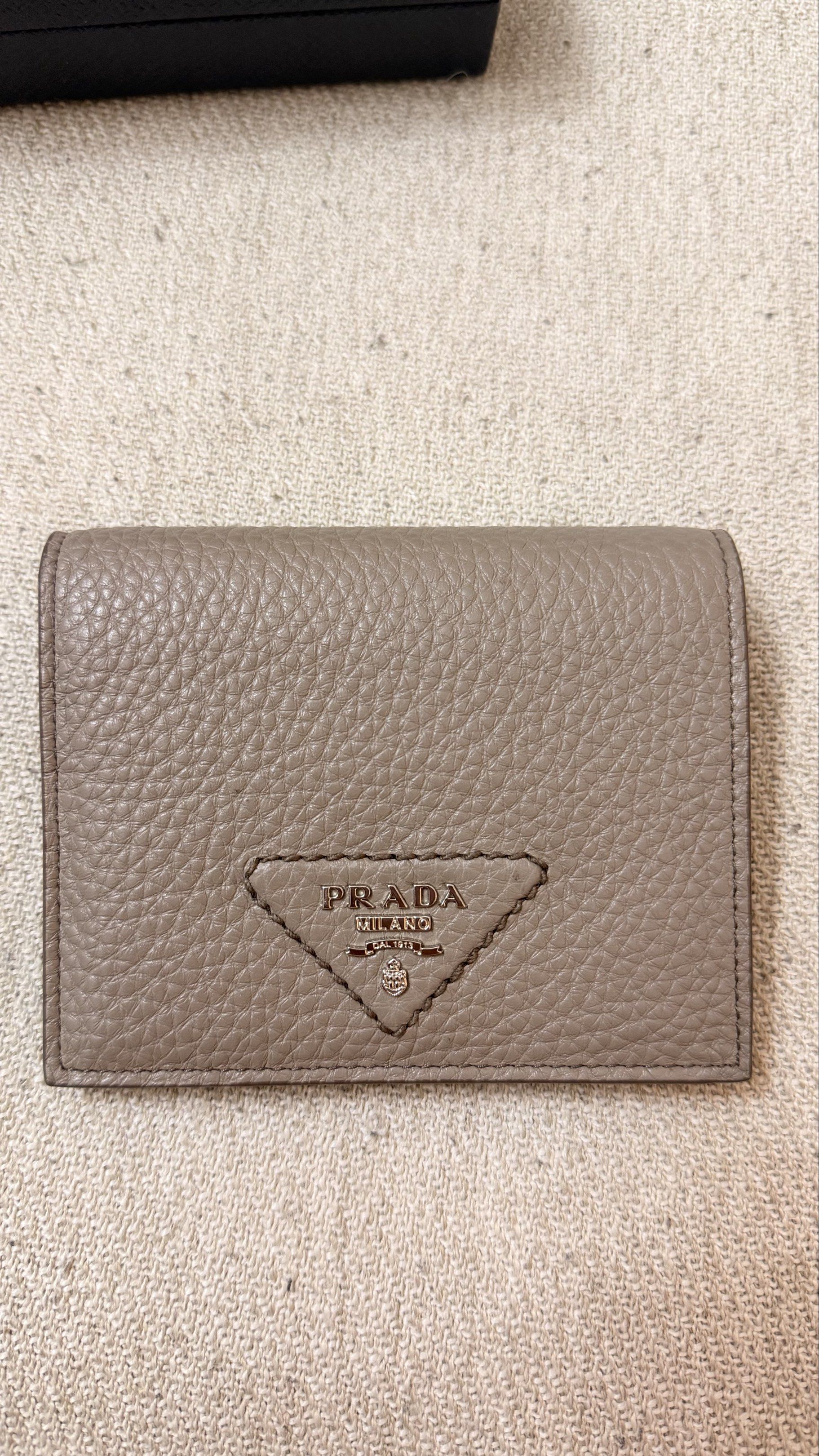 Prada Vitello Daino Leather Bifold Wallet (Category: Luxury Bags & Wallets) located in Bacoor. Submitted by maddysbff (Listing ID 1420722433, Image 2). Description: - Bought in Lisbon Portugal - Guaranteed Original Prada - Good as new - Pristine Condition - With authenticity card - RFS: Decluttering.