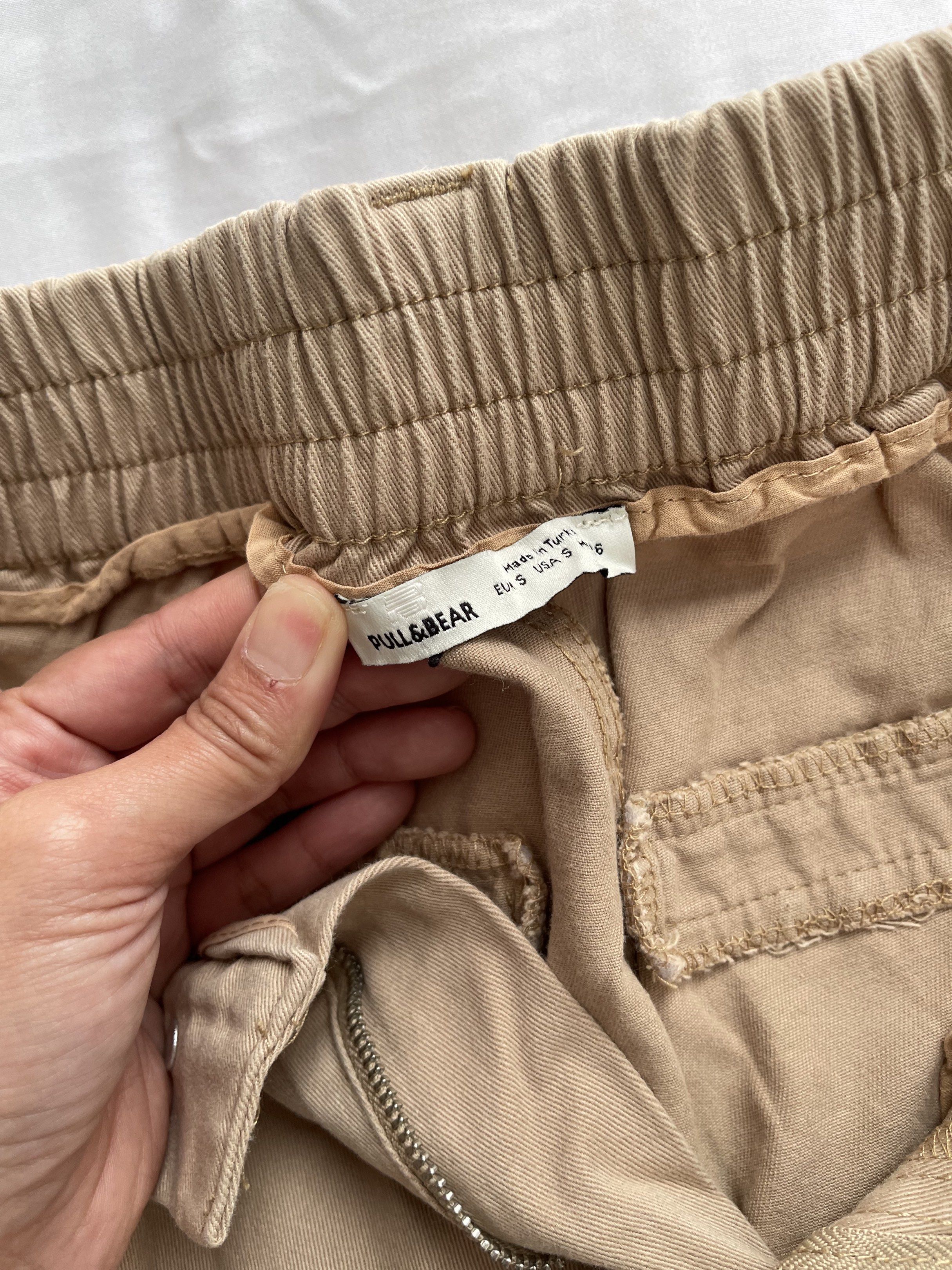 Pull&Bear Khaki Jogger Pants (Category: Joggers) located in Manila. Submitted by joyobaldo158861 (Listing ID 1420564129, Image 2). Description: - Pull&Bear jogger pants - Color: Khaki - Size: EU 36 / US 6 - Features: Elastic waistband, pockets - Condition: Minor tear on elastic cuff - Made in Turkey.