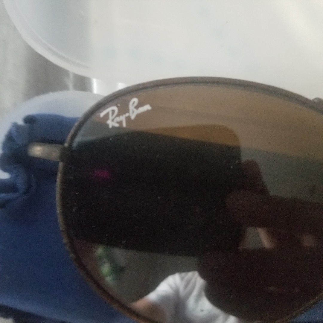 Ray-Ban Round Metal Sunglasses (Category: Sunglasses & Eyewear) located in Paranaque City. Submitted by showboat (Listing ID 1420643410, Image 2). Description: Ray-Ban sunglasses - Classic round metal frame - Brown lenses - Features Ray-Ban logo - Dark brown/bronze frame color - Includes case and cleaning cloth - Perfect for everyday wear.