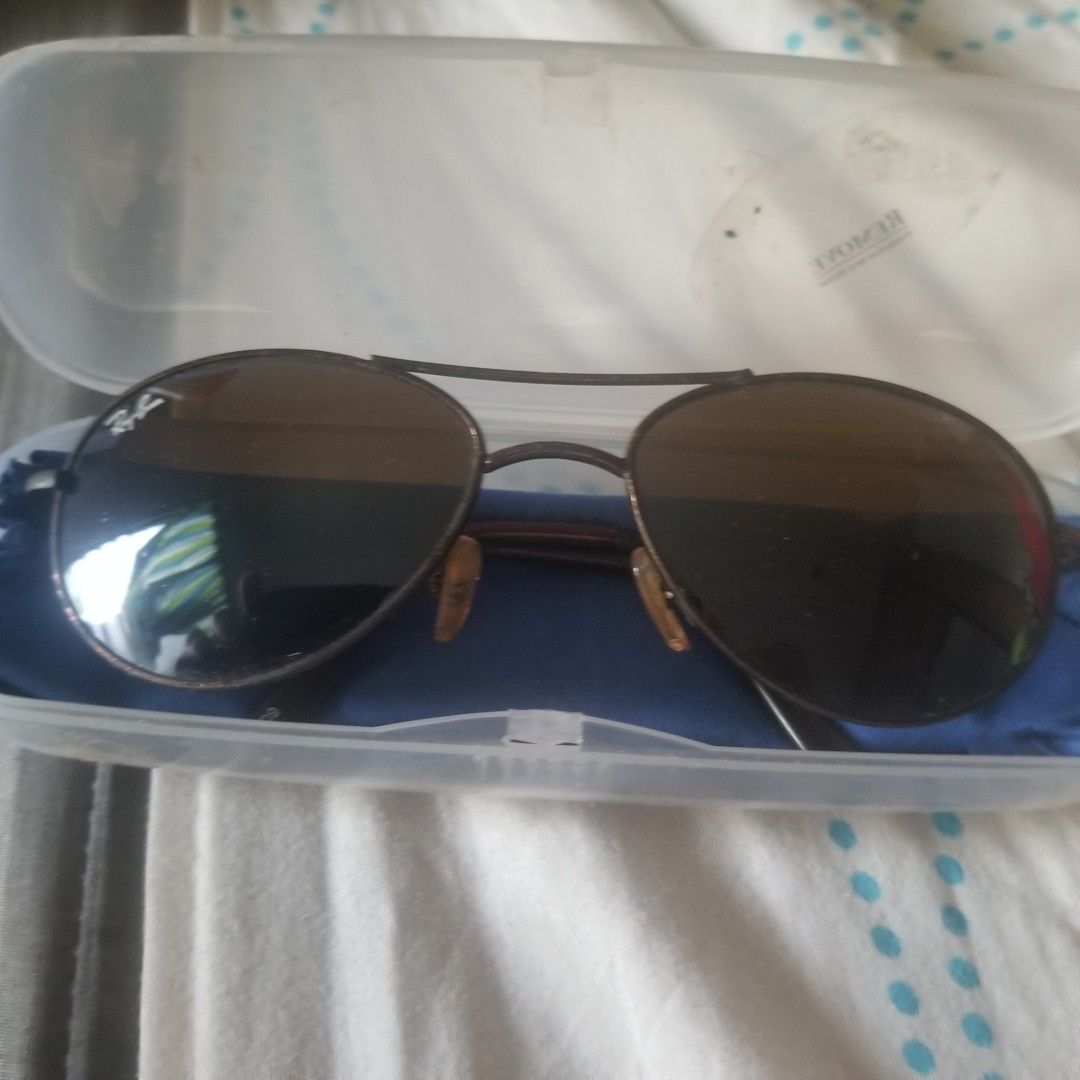 Ray-Ban Round Metal Sunglasses (Category: Sunglasses & Eyewear) located in Paranaque City. Submitted by showboat (Listing ID 1420643410, Image 1). Description: Ray-Ban sunglasses - Classic round metal frame - Brown lenses - Features Ray-Ban logo - Dark brown/bronze frame color - Includes case and cleaning cloth - Perfect for everyday wear.