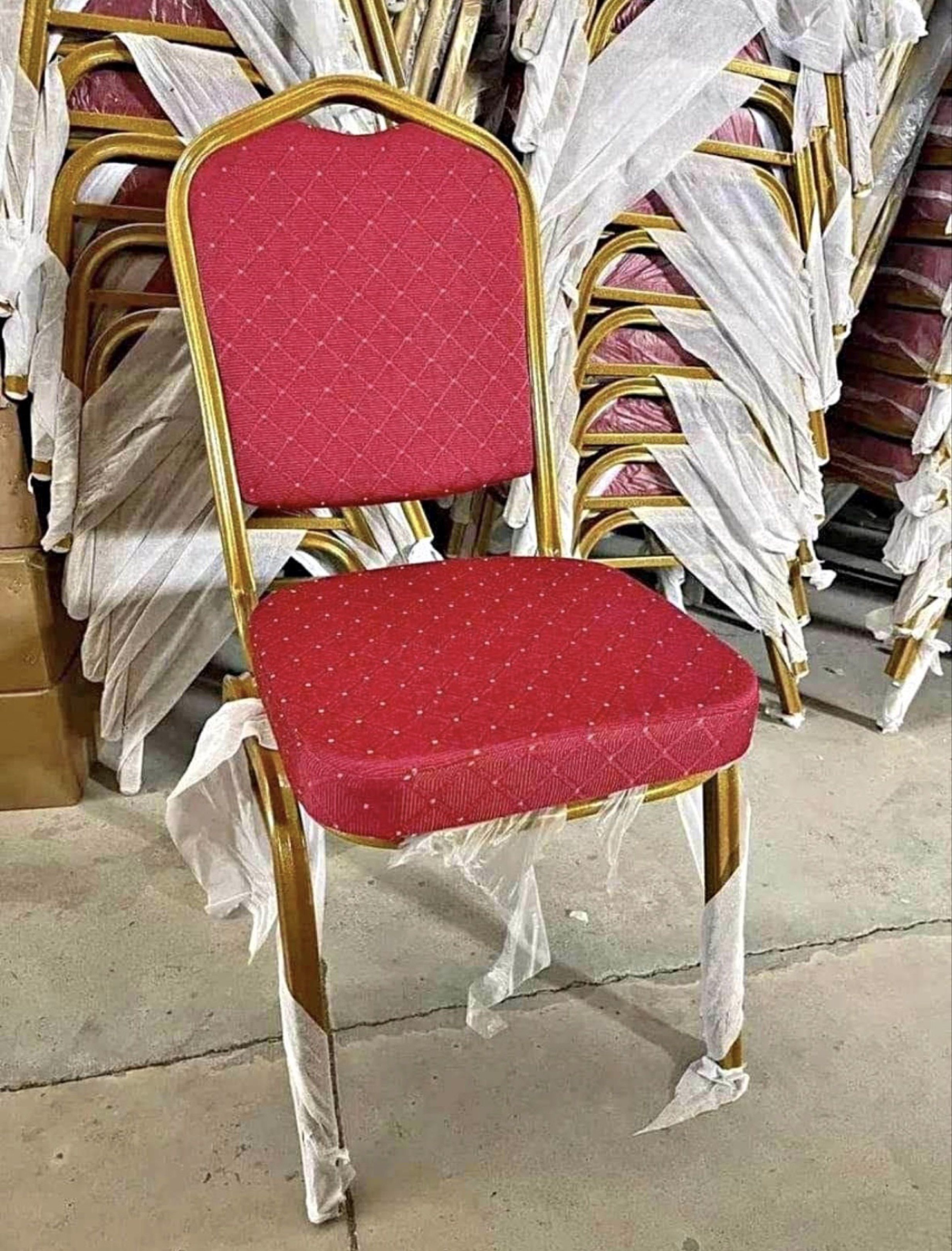 Red Banquet Chair for Dining/Resto/Event (Category: Chairs) located in Manila. Submitted by mry_rfl (Listing ID 1420737449, Image 2). Description: - Elegant banquet chairs - Red upholstered seat and backrest - Gold-colored metal frame - Suitable for events and dining - Classic and versatile design - Durable and comfortable.