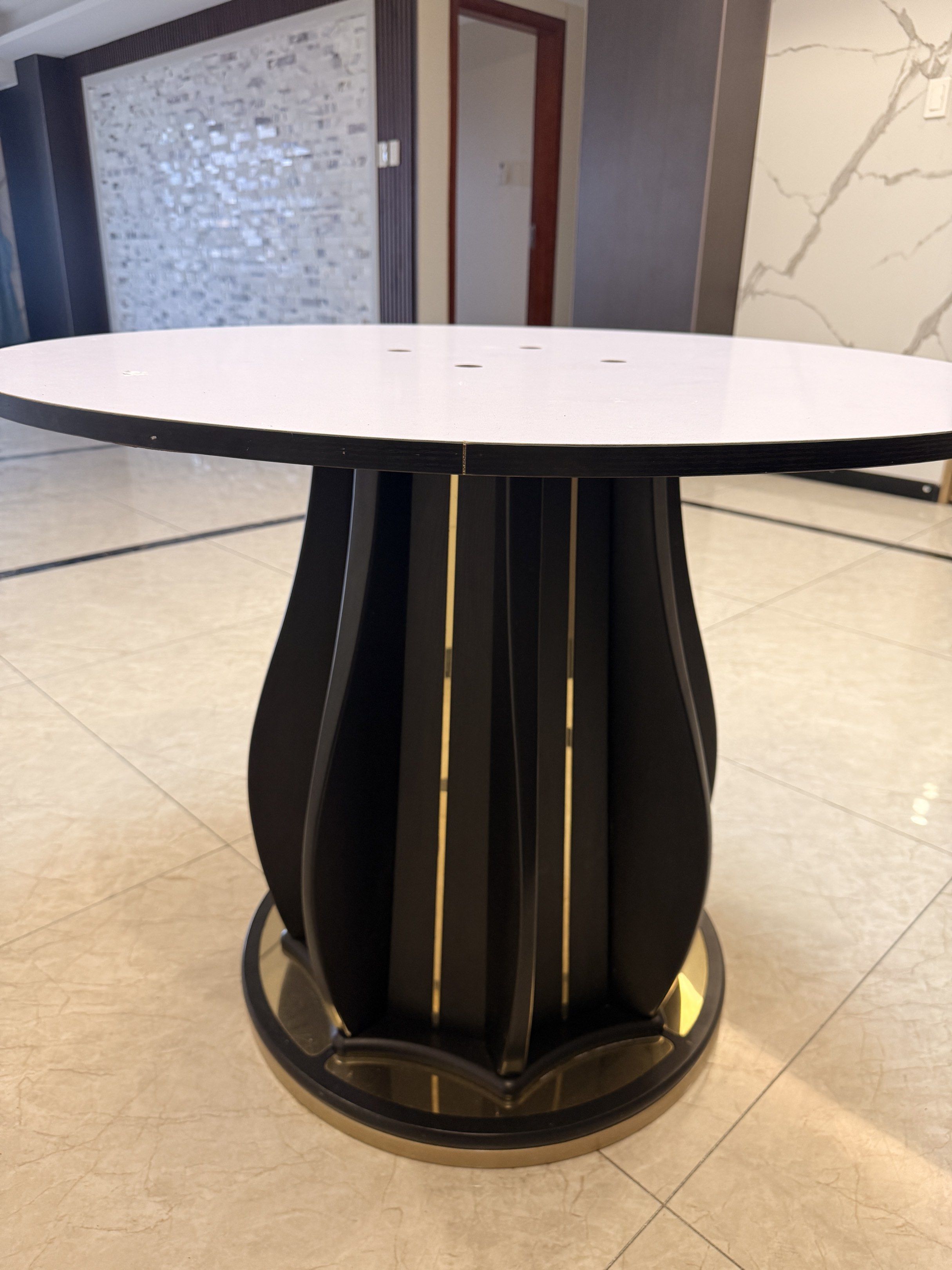 Round Table (Category: Tables & Sets) located in Quezon City. Submitted by luxearchives (Listing ID 1420688802, Image 2). Description: - Round table - Modern design - White tabletop - Black base with gold accents - Ideal for various spaces.