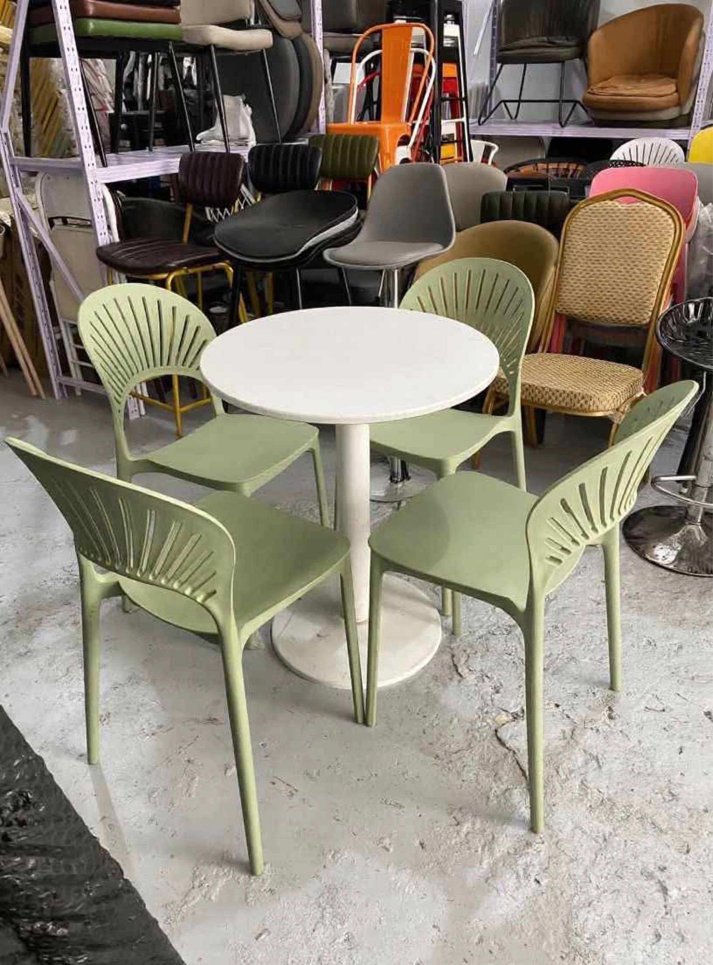 Round/Square Table with Chairs (Category: Tables & Sets) located in Manila. Submitted by mry_rfl (Listing ID 1420737583, Image 1). Description: - White table with four chairs - Available in green or yellow - Unique chair back design - Single pedestal table base - Ideal for small spaces - Suitable for indoor or outdoor use.