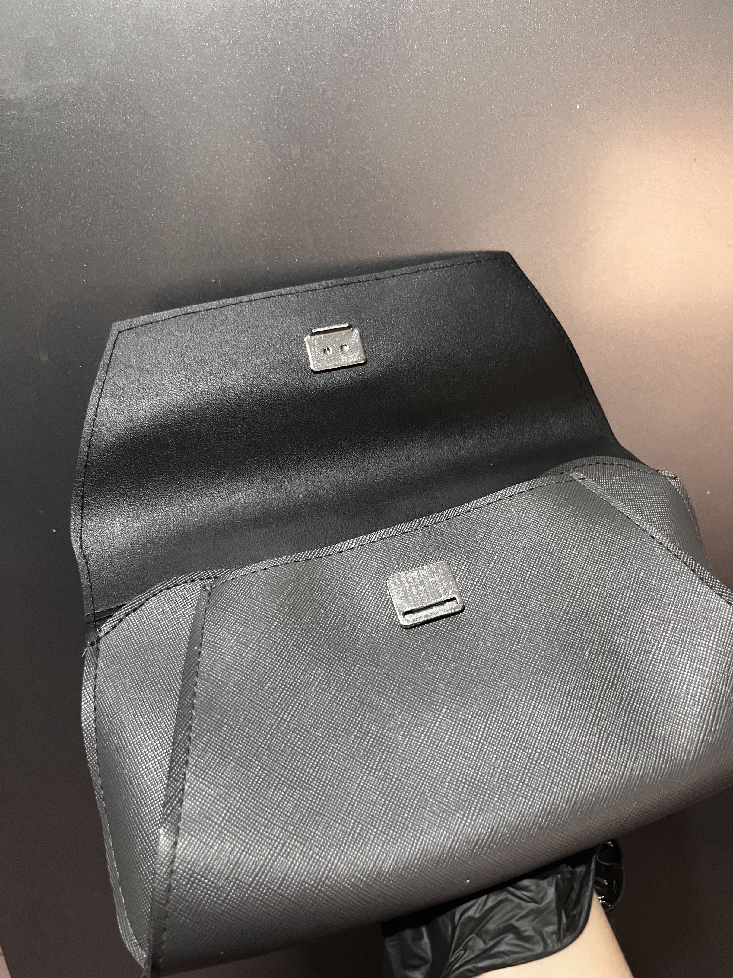 Salvatore Ferragamo Clutch Pouch (Category: Luxury Bags & Wallets) located in Manila. Submitted by kathprima (Listing ID 1420576086, Image 3). Description: - Salvatore Ferragamo clutch in grey - Flap closure with silver-tone clasp - Features the brand's logo - Textured exterior - Single interior compartment.