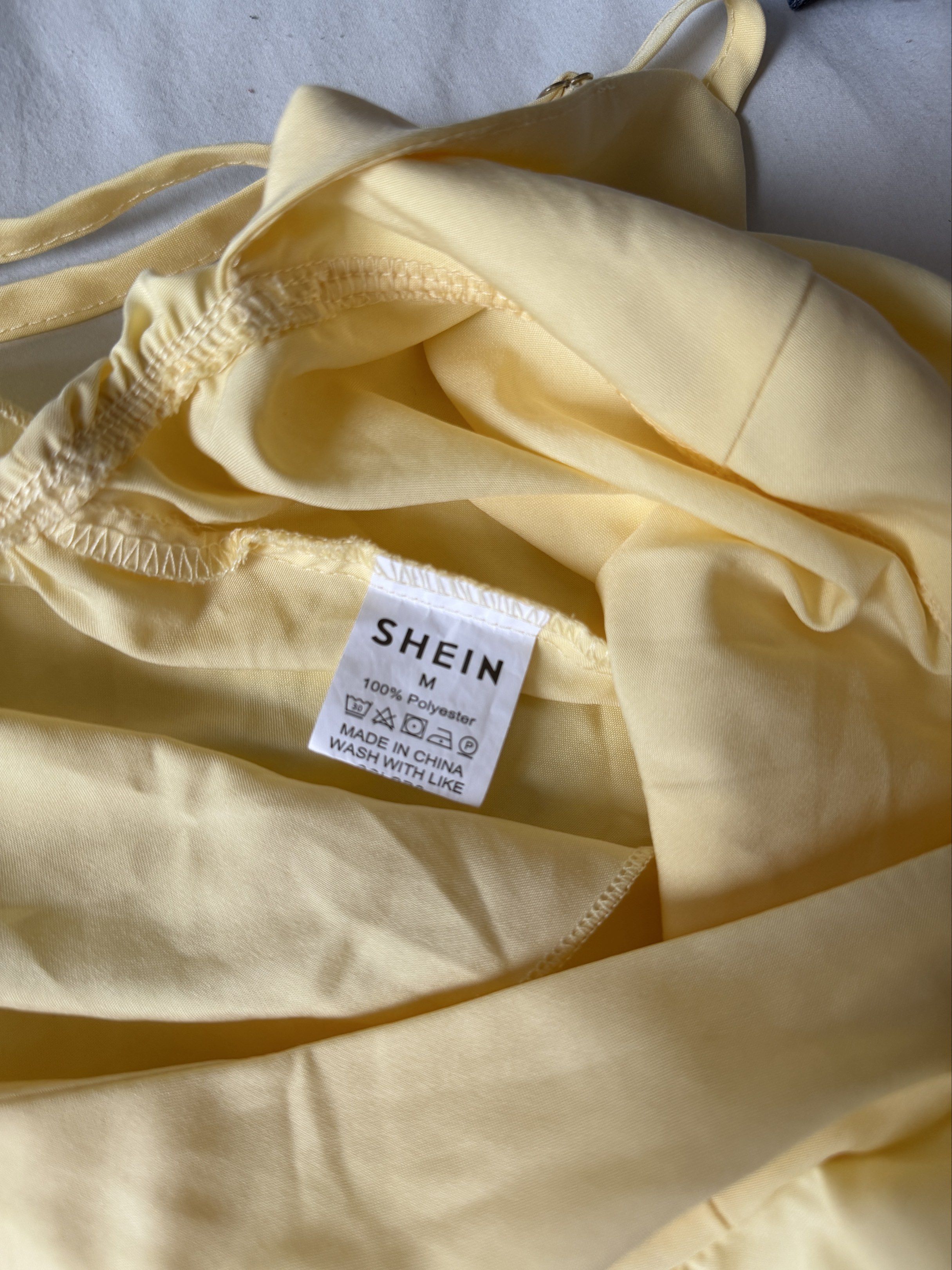 Shein Ruffled Spaghetti Strap Top - Yellow (Category: Sleeveless) located in Taguig. Submitted by 77dbae (Listing ID 1420570262, Image 3). Description: Shein yellow spaghetti strap top - used twice - 29.5in bust, 19.3in length - adjustable straps rfs: decluttering.