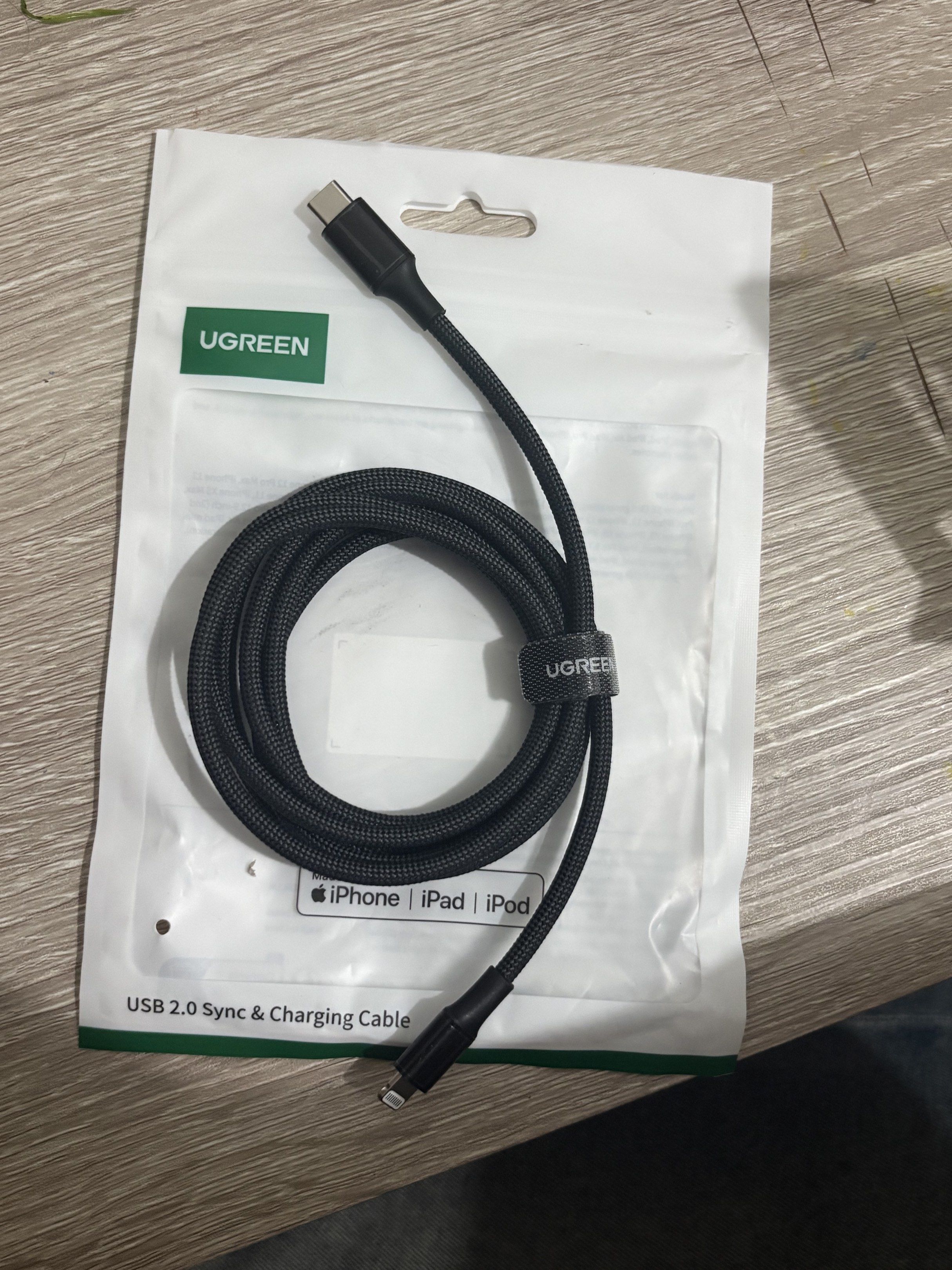 Ugreen USB 2.0 Sync & Charging Cable (Category: Chargers & Cables) located in Manila. Submitted by piolinemartina (Listing ID 1420662478, Image 1). Description: - RFS: bought the wrong item - Ugreen USB-C to Lightning cable - Compatible with iPhone, iPad, and iPod - Black, braided design - Durable and long-lasting - Syncs and charges your devices.