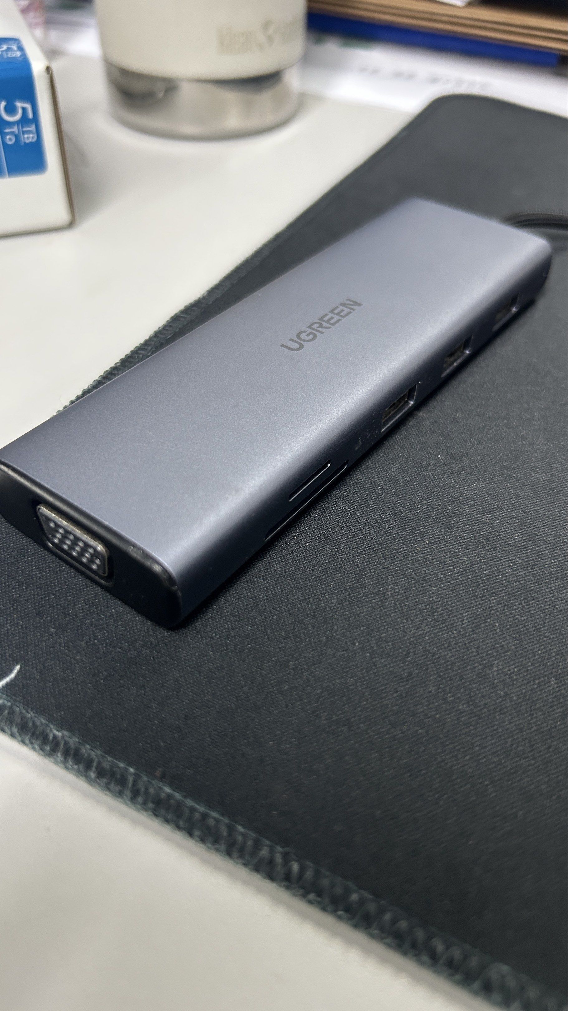 UGREEN USB-C Hub (Category: Cables & Adaptors) located in Makati City. Submitted by mrmagic.ph8888 (Listing ID 1420567987, Image 3). Description: - UGREEN USB-C Hub for expanded connectivity. - Ports: HDMI, Ethernet, VGA, USB, and Audio Jack. - Sleek gray design. - USB-C connector for easy connection. - Perfect for connecting multiple devices to your laptop or tablet..