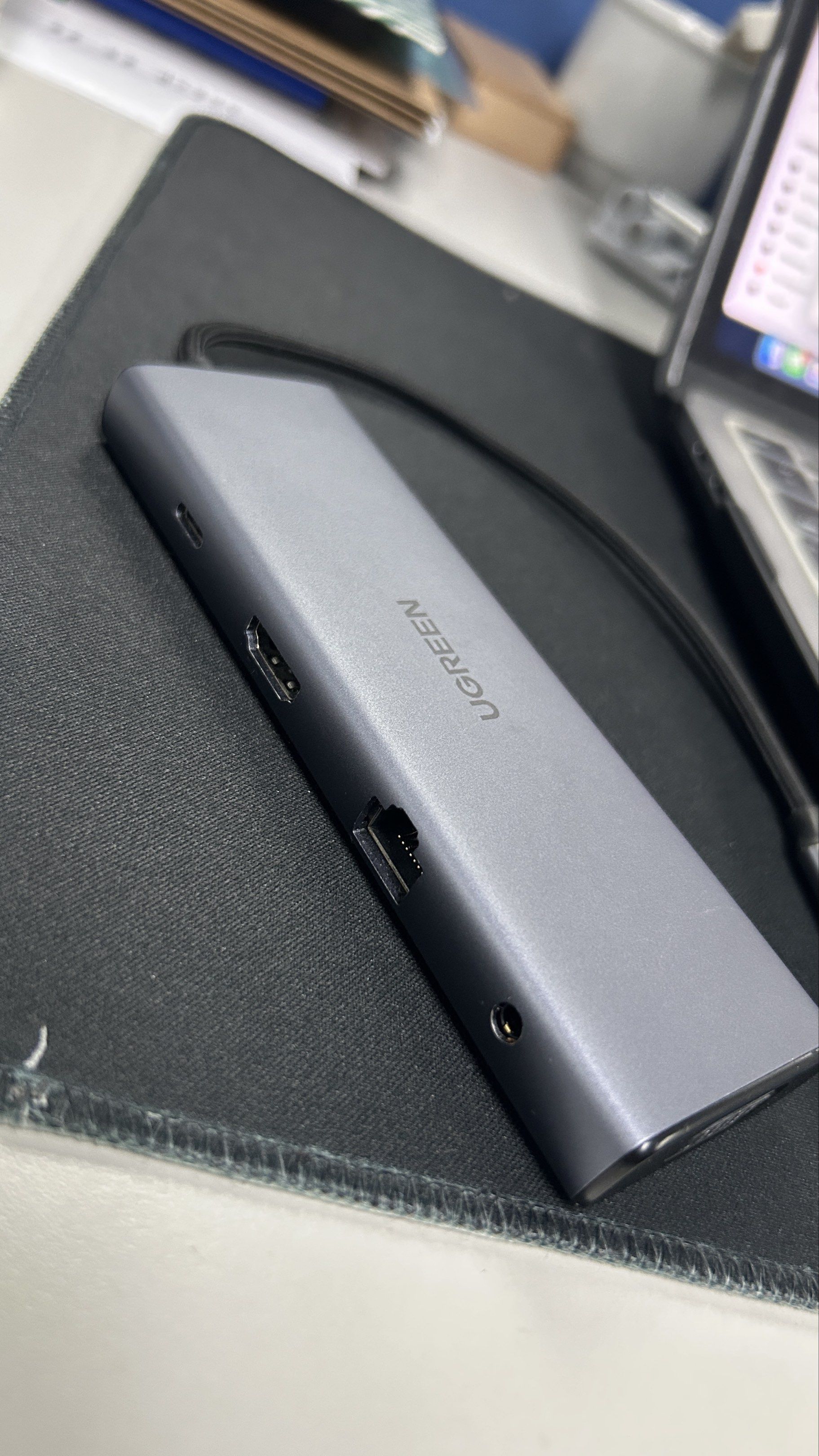 UGREEN USB-C Hub (Category: Cables & Adaptors) located in Makati City. Submitted by mrmagic.ph8888 (Listing ID 1420567987, Image 2). Description: - UGREEN USB-C Hub for expanded connectivity. - Ports: HDMI, Ethernet, VGA, USB, and Audio Jack. - Sleek gray design. - USB-C connector for easy connection. - Perfect for connecting multiple devices to your laptop or tablet..
