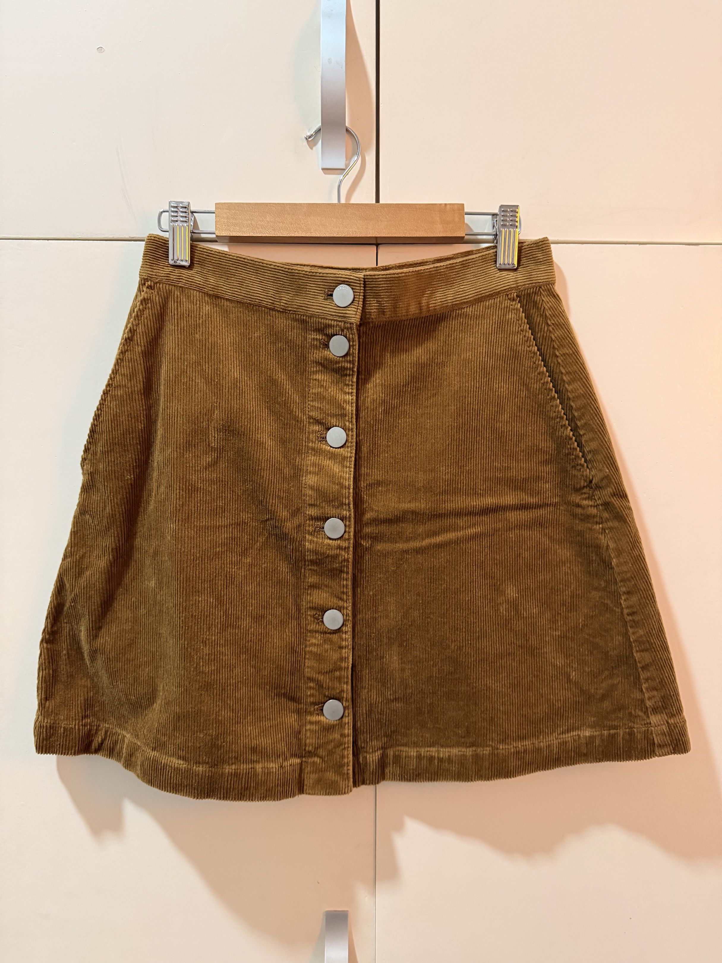 Uniqlo Corduroy Button-Down Skirt (Category: Skirts) located in Cabanatuan. Submitted by geleen.declutter (Listing ID 1420654353, Image 1). Description: - Uniqlo corduroy skirt - Classic A-line silhouette - Button-down design - Color: Brown - Two front pockets See photos for size and fitting No issues, only worn once on new year's.