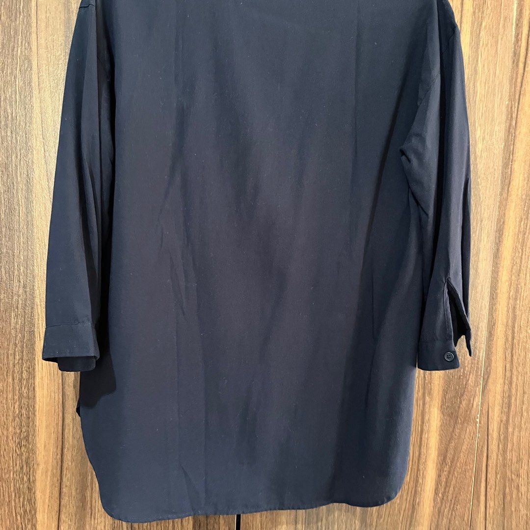 Uniqlo Rayon Navy blue Top (Category: Blouses) located in Angeles City. Submitted by mdxnix (Listing ID 1420592418, Image 2). Description: - S on tag - 8.5/10 condition - The color of the item may vary slightly due to photographic lighting - Strictly no return/ no exchange - I am no longer liable once the item has been shipped out to the courier - Sf will be shouldered by the buyer - Mode of Payment: Gcash/ Maya - Mode of Delivery: J&T (if possib