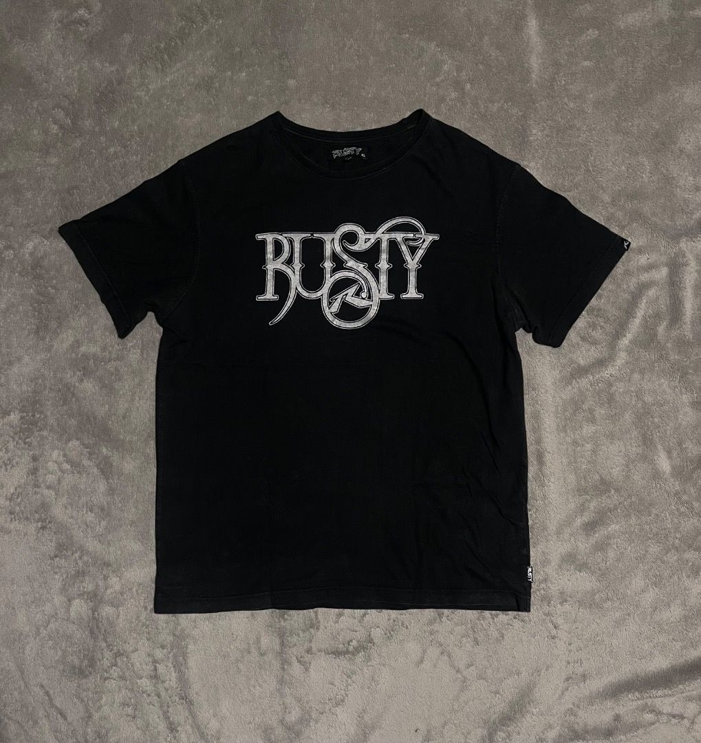 Y2K Vintage Rusty Surf tee/ shirt (Category: Tshirts & Polo Shirts ) located in Davao. Submitted by batz11 (Listing ID 1420744659, Image 1). Description: Y2K RUSTY Condition: Very good condition Color rate: 9.5/10 Dimensions: 21 x 28 21 width/ 28 length Issue: minor hairline, barely visible. (Check photos for reference) DAVAO CITY LOC. CAN SHIP THROUGH J&T PM IF INTERESTED 📥.