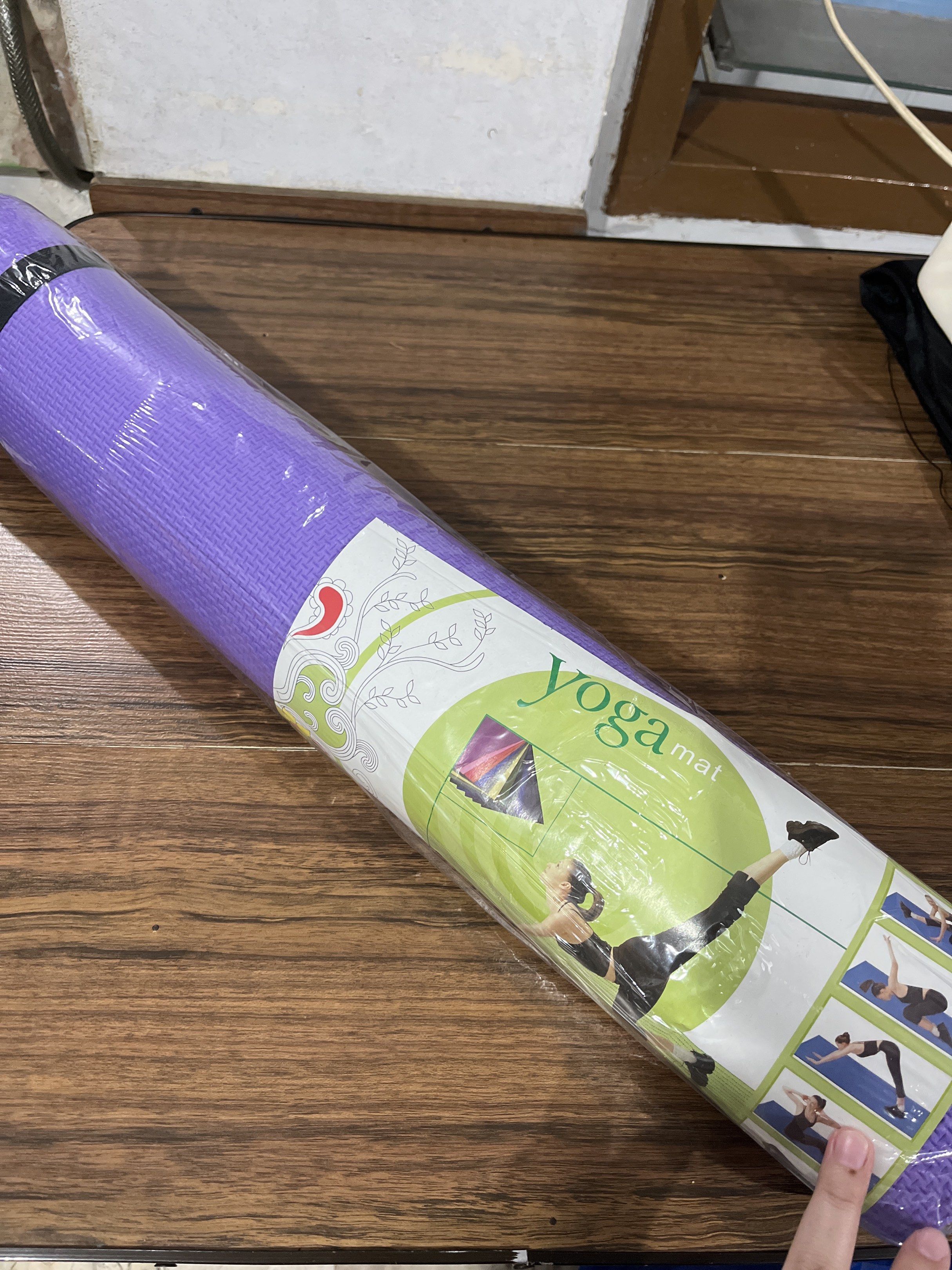 Yoga Mat (Category: Exercise Mats) located in San Fernando. Submitted by minkartmin (Listing ID 1420602787, Image 1). Description: Purple yoga mat, rolled and wrapped in plastic. RFS: Yoga Mat.