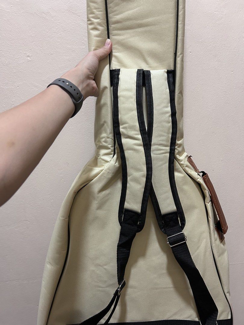 Acoustic Guitar Soft Case / Gig Bag (Category: Musical Instruments) located in Dumaguete. Submitted by bunchings.books (Listing ID 1424142238, Image 3). Description: 🎸 Acoustic Guitar Soft Case / Gig Bag 📏 Size: 1.05m x 43cm (fits standard full-size acoustic guitar) ✔ Padded interior ✔ Backpack straps ✔ Side handle ✔ Multiple zip pockets for tuner, capo, strings, etc. ✔ Zippers all working Condition: Lightly used. No tears. Minor creasing from 