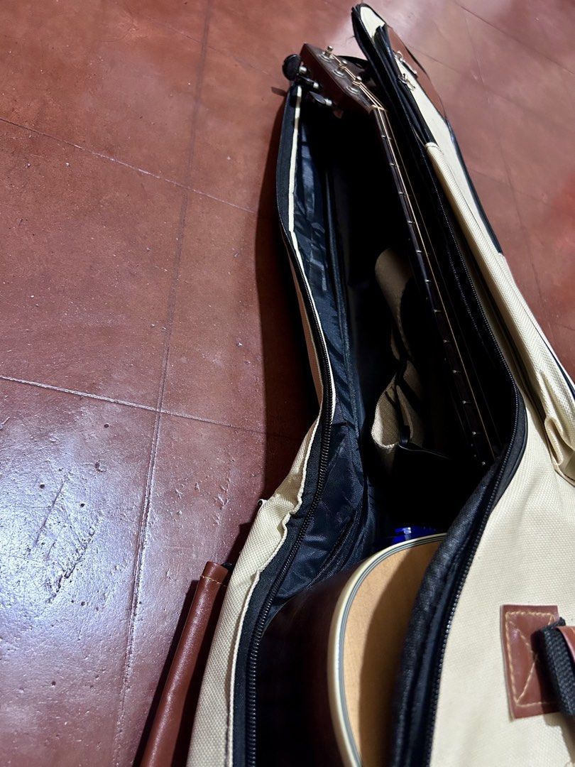 Acoustic Guitar Soft Case / Gig Bag (Category: Musical Instruments) located in Dumaguete. Submitted by bunchings.books (Listing ID 1424142238, Image 2). Description: 🎸 Acoustic Guitar Soft Case / Gig Bag 📏 Size: 1.05m x 43cm (fits standard full-size acoustic guitar) ✔ Padded interior ✔ Backpack straps ✔ Side handle ✔ Multiple zip pockets for tuner, capo, strings, etc. ✔ Zippers all working Condition: Lightly used. No tears. Minor creasing from 