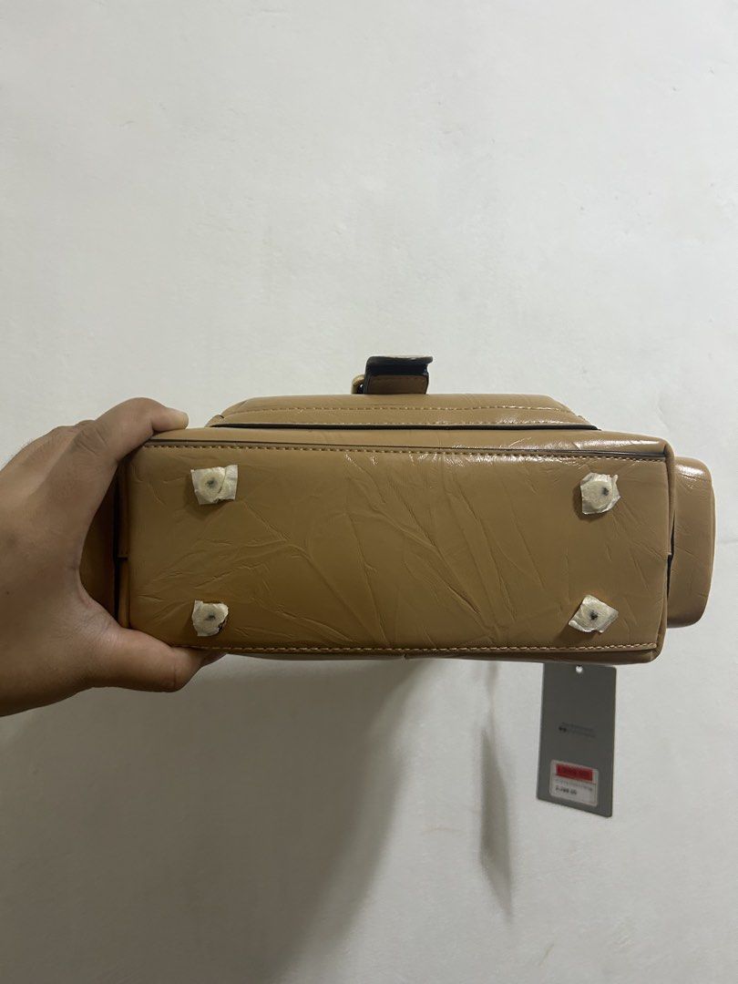 Alberto Caroline Mini Handbag - Nude (Category: Luxury Bags & Wallets) located in Caloocan City. Submitted by bbtorres2023 (Listing ID 1424122675, Image 2). Description: Brand New & Original Caroline Mini Nude Color ORIGINAL Alberto, not dupe or Class A Design po yung crease lines, hindi po yan damage Bought from sale, but never used.