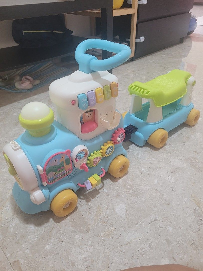 VTech interactive Train (Category: Infant Playtime) located in Singapore. Submitted by wisebuys26 (Listing ID 1423977175, Image 1). Description: - Unique pastel soothing colours for kids unlike the others on the market. - Features interactive toys and activities - Sturdy and safe design - Helps babies develop walking skills, ride along on the train - pretend play to pull along a trolley attachment - Grows with them, has music and interactivity.