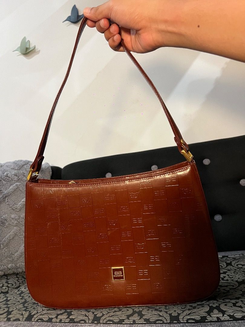 Rare Balenciaga Paris Shoulder Bag (Category: Luxury Bags & Wallets) located in Quezon City. Submitted by just.loveclub (Listing ID 1424156893, Image 1). Description: - Balenciaga Paris shoulder bag - Brown color with logo pattern - Interior zipper pocket - Gold-toned hardware - Shoulder strap.