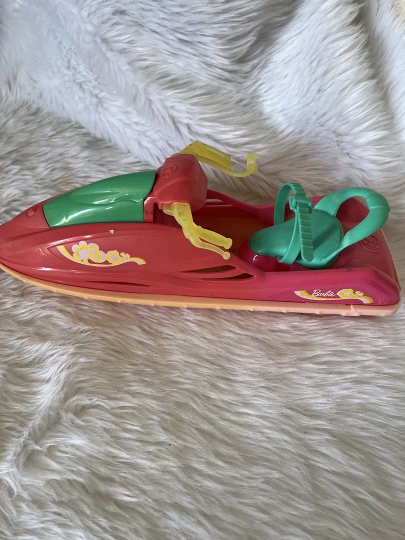 Barbie Camping fun Jet Ski 2016 (Category: Toys & Games) located in Hermosa. Submitted by hollimolly_ (Listing ID 1423985537, Image 1). Description: - Barbie Jet Ski toy - Pink and green color scheme with yellow accents - Includes seat and handlebars - Features the Barbie logo - Great for kids who love Barbie and water play.