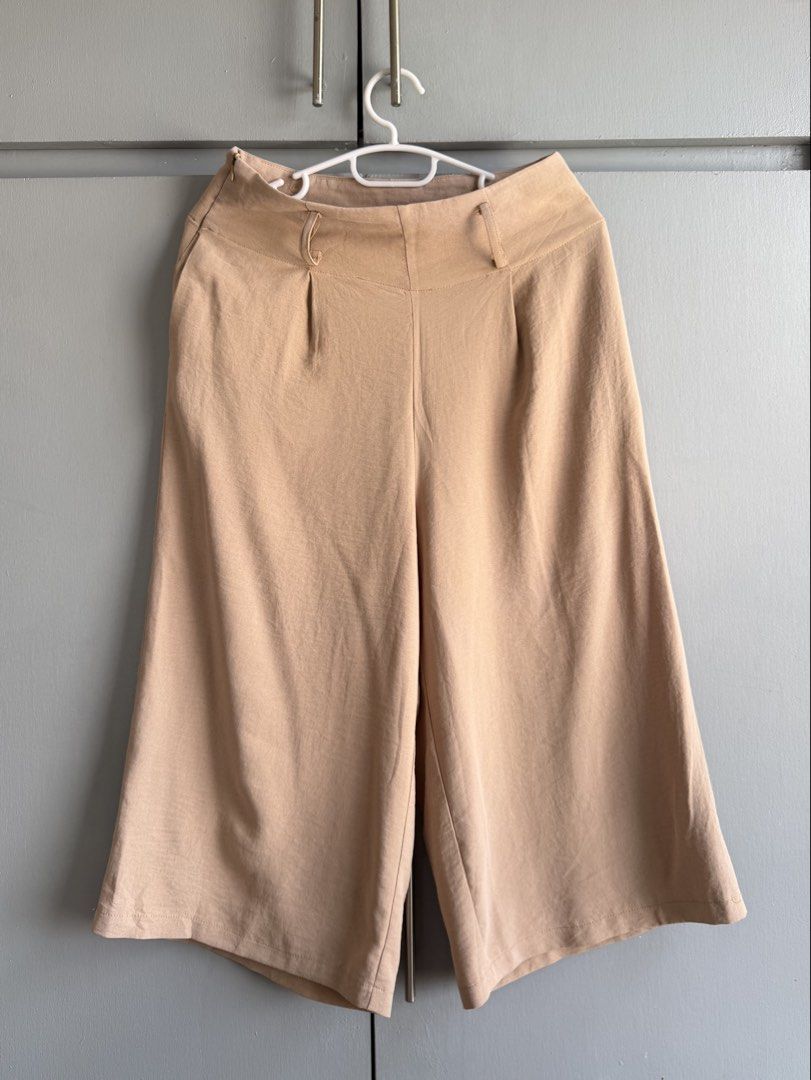 Beige Culottes/ Square Pants (size 27-28) (Category: Other Bottoms) located in San Juan City. Submitted by itemsfromkam (Listing ID 1423985751, Image 1). Description: • fits size 27-28 • high waist, pleated front, wide leg, side zip, flowy • approx. measurements: waist: 14" laid flat length: 29" hips: up to 40".