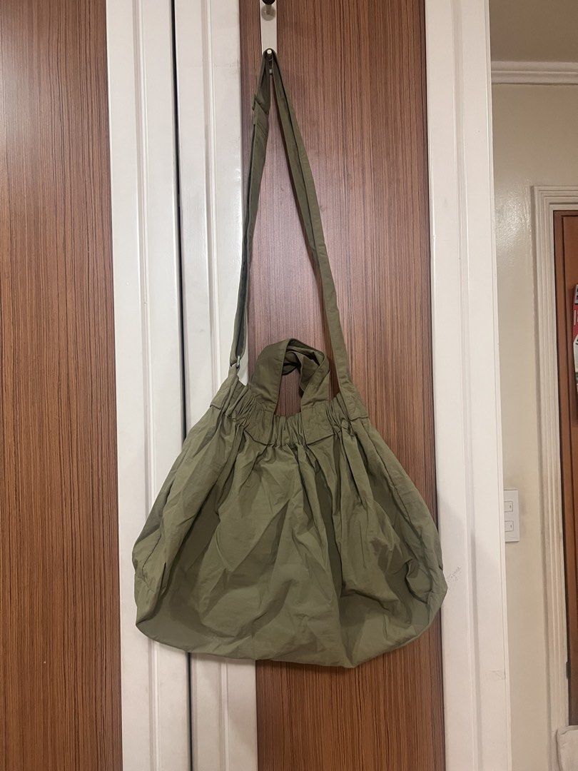 Beyond The Vines Dumpling Bag (Category: Tote Bags) located in Quezon City. Submitted by lightningdream (Listing ID 1424106685, Image 3). Description: Olive green dumpling bag in medium. Added photos of minor flaws. The paint has chipped a little bit and in the last photo, there are two small holes in the front pocket at are from pins previously placed there but it’s barely noticeable:).