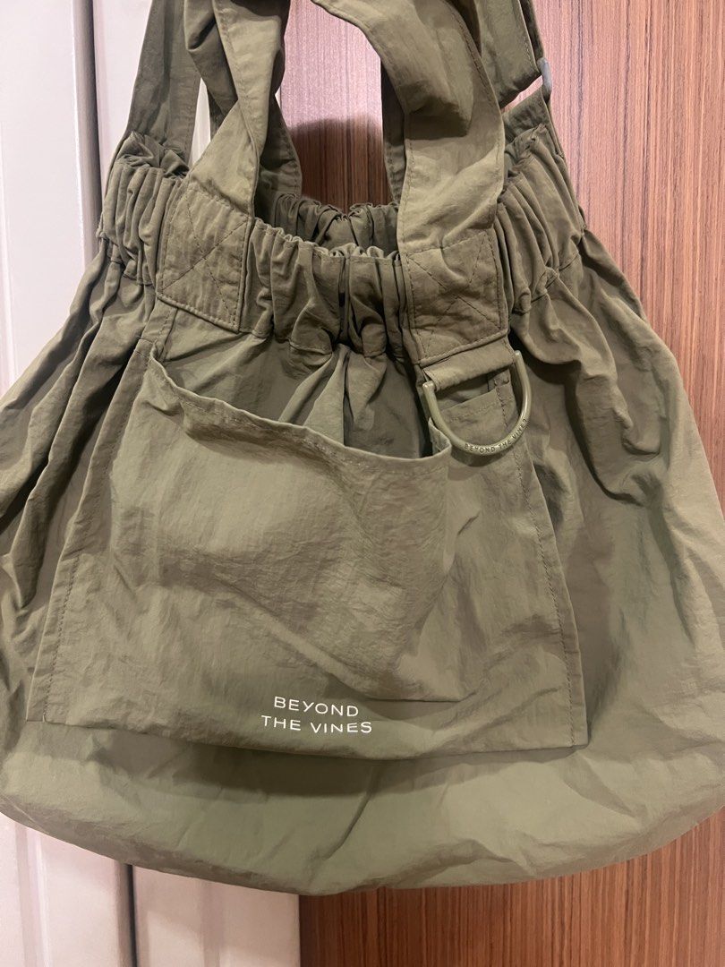 Beyond The Vines Dumpling Bag (Category: Tote Bags) located in Quezon City. Submitted by lightningdream (Listing ID 1424106685, Image 2). Description: Olive green dumpling bag in medium. Added photos of minor flaws. The paint has chipped a little bit and in the last photo, there are two small holes in the front pocket at are from pins previously placed there but it’s barely noticeable:).