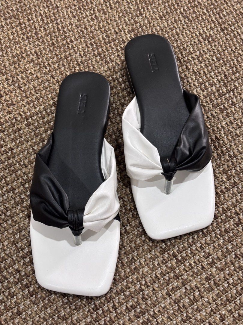 Black and White Knot Sandals (Category: Flats & Sandals) located in Caloocan City. Submitted by stuff_shop (Listing ID 1423980807, Image 2). Description: - Stylish two-tone sandals - Features a knot detail - Square toe design - Small heel - Comfortable footbed - soft, padded insole - Perfect for everyday use.