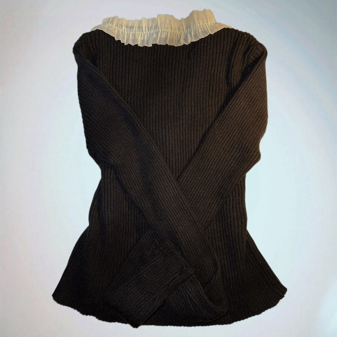 Black Ribbed Sweater with Ruffle Detail (Category: Longsleeves) located in Manila. Submitted by aveileu (Listing ID 1424043759, Image 2). Description: - Black ribbed knit sweater - Long sleeves - V-neckline with ruffle trim - Fitted style - Versatile for layering or standalone wear.