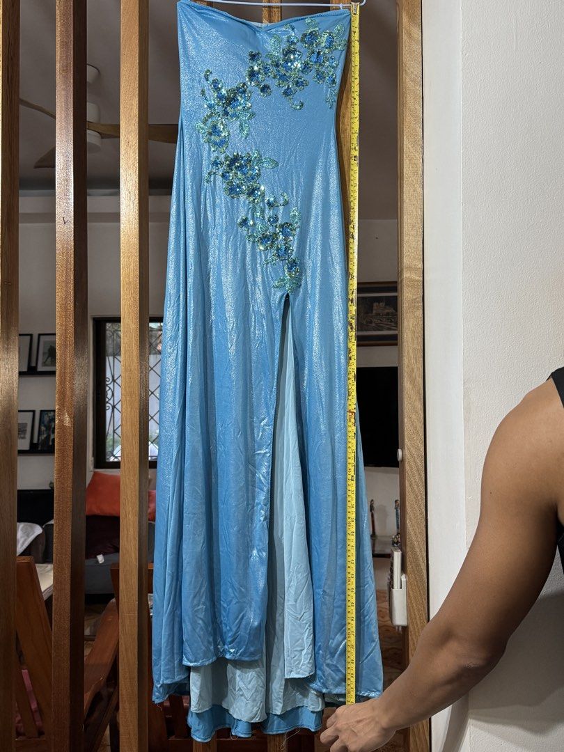 Blue Strapless Evening Gown with Embellishments (Category: Evening dresses & gowns) located in Muntinlupa City. Submitted by readthedetails (Listing ID 1424119893, Image 2). Description: Elegant strapless evening gown in a beautiful shade of blue. Features intricate sequin embellishments on the bodice. The dress has a high slit and a layered design. The length of the dress is approximately 130cm. Perfect for special occasions..