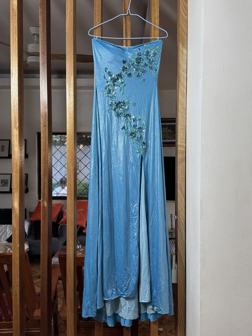 Blue Strapless Evening Gown with Embellishments (Category: Evening dresses & gowns) located in Muntinlupa City. Submitted by readthedetails (Listing ID 1424119893, Image 1). Description: Elegant strapless evening gown in a beautiful shade of blue. Features intricate sequin embellishments on the bodice. The dress has a high slit and a layered design. The length of the dress is approximately 130cm. Perfect for special occasions..