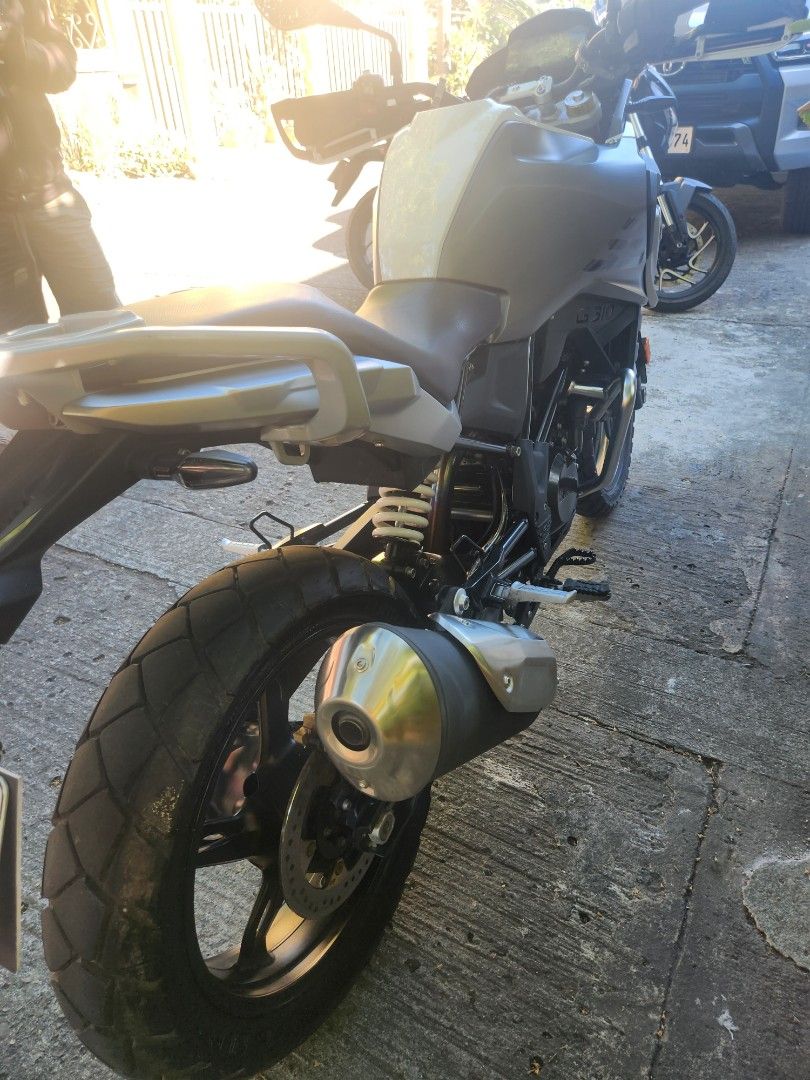 BMW G 310 GS Motorcycle (Category: Motorbikes for Sale) located in Marikina City. Submitted by dc778w (Listing ID 1424047906, Image 3). Description: BMW G 310 GS motorcycle. Features a white and grey color scheme. The motorcycle has a digital display showing 2836 km. Includes a windshield and rear rack. The motorcycle is equipped with a single exhaust. Lowering kit installed already. Complere with casa record from BMW daang hari. Easytrip & Autos
