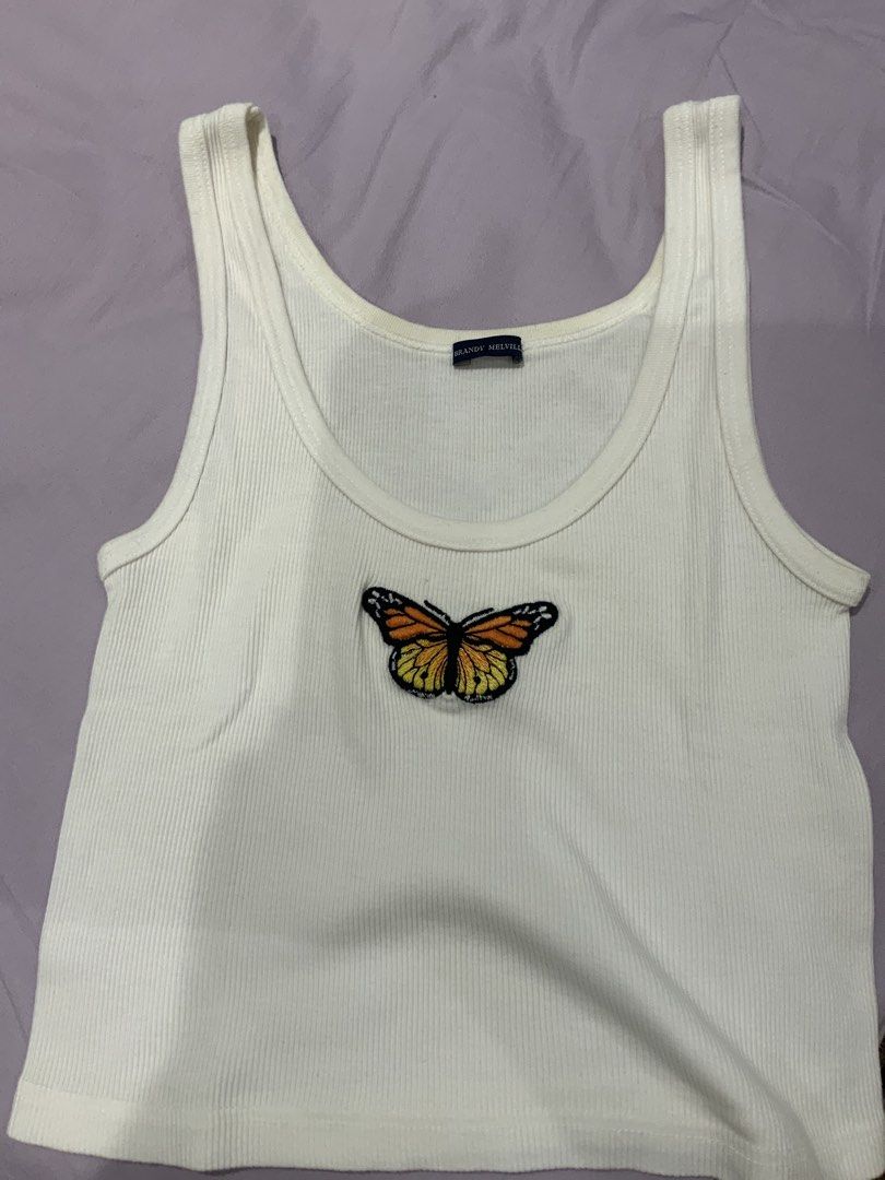 Brandy Melville Butterfly Tank Top (Category: Sleeveless) located in Quezon City. Submitted by ak3isha (Listing ID 1424074043, Image 1). Description: - Never Worn - Ribbed texture - Butterfly patch - Scoop neckline - Sleeveless.