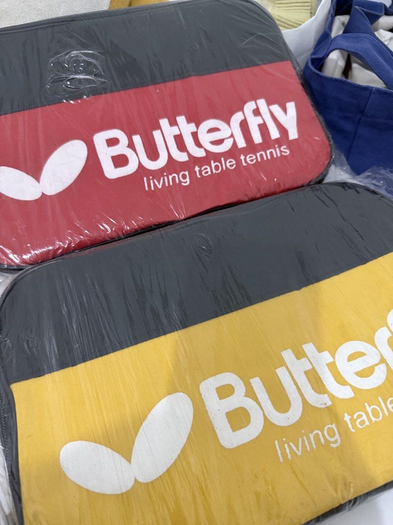 Butterfly Table Tennis Table Racket Bag (Category: Racket and Ball Sports) located in Quezon City. Submitted by mochiringo84 (Listing ID 1424128519, Image 1). Description: - Brand new Butterfly table tennis table cover. - Features the Butterfly logo. - Includes "living table tennis" text. - Available in red and yellow colors. - Price is considered per piece. - Comes in original packaging..