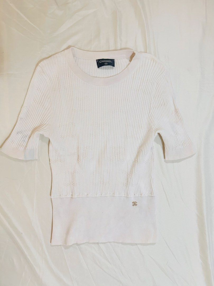 Chanel Top (Category: Luxury Apparel) located in Manila. Submitted by frommyclosettoyours016 (Listing ID 1424004708, Image 2). Description: - Authentic Chanel ribbed knit top - Short sleeves - Round neckline - Contrasting lower panel - Chanel logo detail - Made in Italy - Size 40 - Flaw: Last photo.