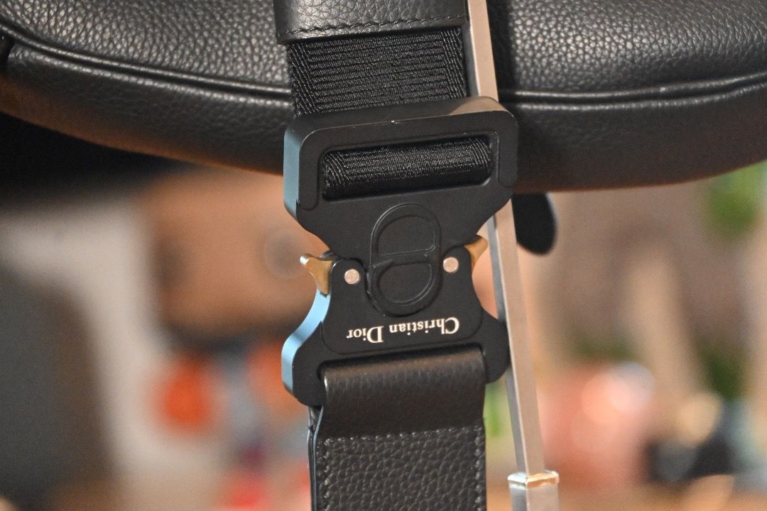 Christian Dior Saddle Bag Black - Men's (Category: Luxury Bags & Wallets) located in Muntinlupa City. Submitted by honestlygood (Listing ID 1423982570, Image 3). Description: Black leather saddle bag from Christian Dior. Features an adjustable strap with a metal buckle closure. The bag has a curved shape with a flap closure. The strap has the Christian Dior logo..