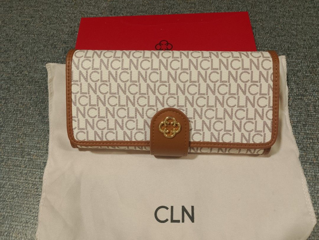 CLN Wallet with Box (Category: Wallets & Card holders) located in Makati City. Submitted by tagzmai (Listing ID 1424100282, Image 1). Description: - CLN wallet with a brown and white design - Gold-colored emblem and snap closure - Includes original box and dust bag - Unused condition - Multiple compartments for cards and cash.