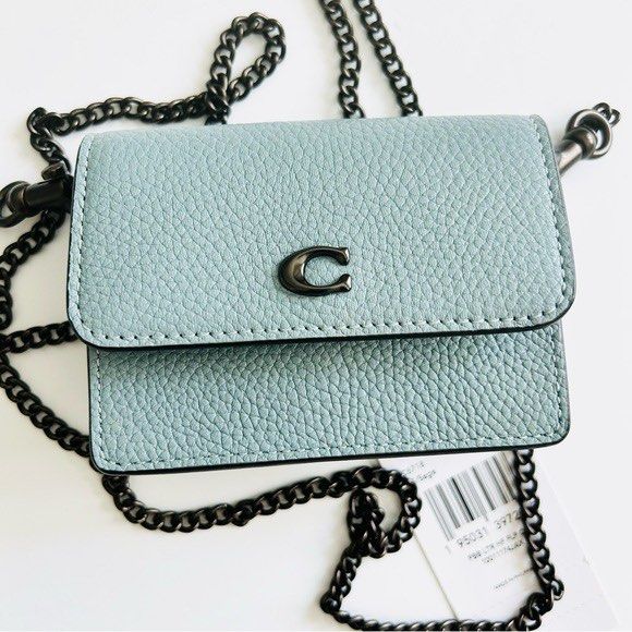 Coach Mini Wallet on Chain Crossbody Bag (Category: Cross-body Bags) located in Makati City. Submitted by cee_store (Listing ID 1424054753, Image 3). Description: Half Flap Card Case Adorable half flap card case in this gorgeous faded blue color from Coach. This is a great accessory that can be worn crossbody or used as a wallet inside your bags!!! It is long sold out, so get it here now before it’s gone!!! Product Details: - Polished pebbled lea