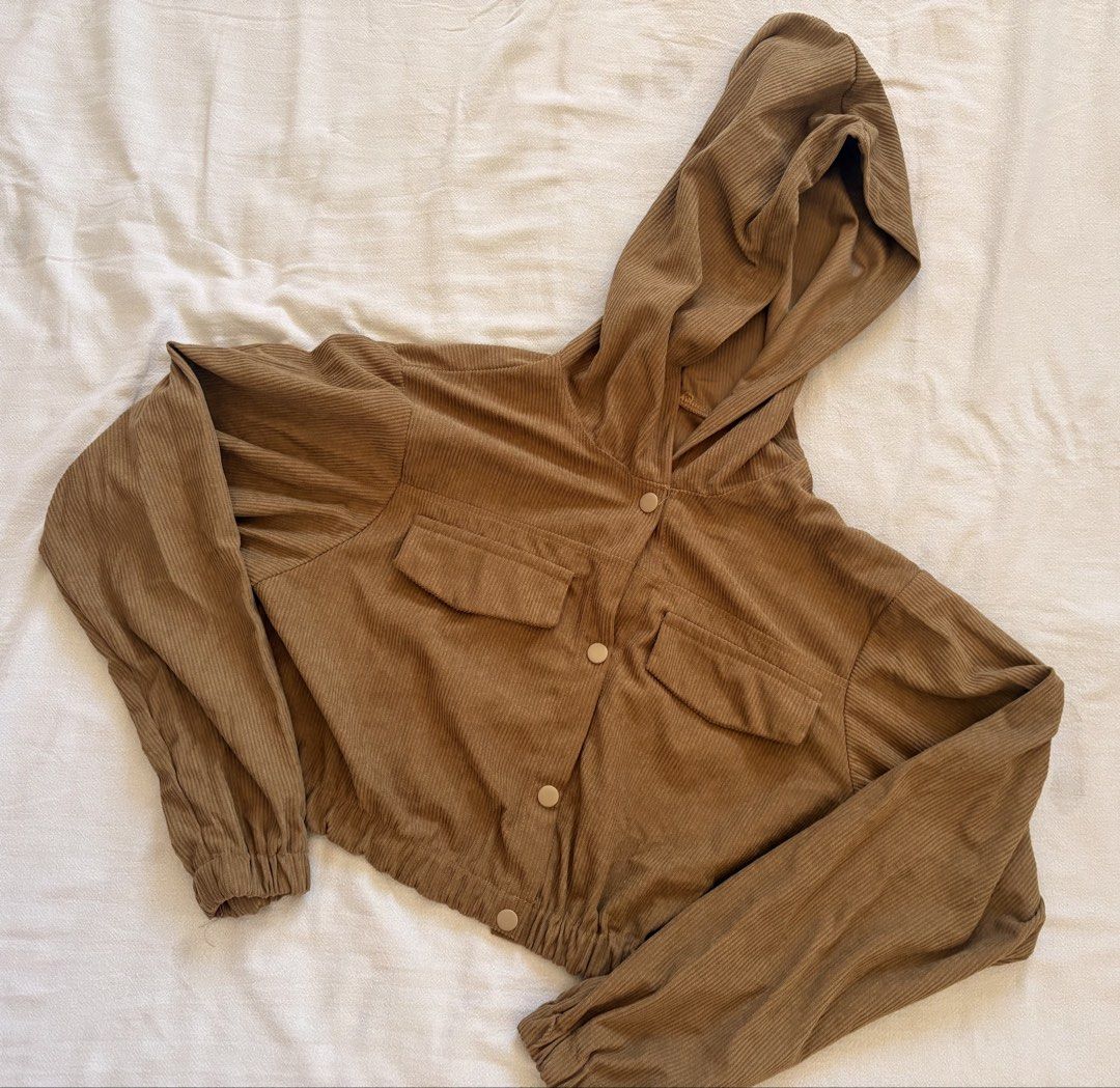 Corduroy Crop Hoodie Jacket (Category: Coats, Jackets and Outerwear) located in Abucay. Submitted by rewornstudio (Listing ID 1423994325, Image 1). Description: - Olive green corduroy crop jacket - Hooded - Two front pockets - Button-up closure - Long sleeves with elastic cuffs - Drawstring hem - Cropped style - Perfect for layering.