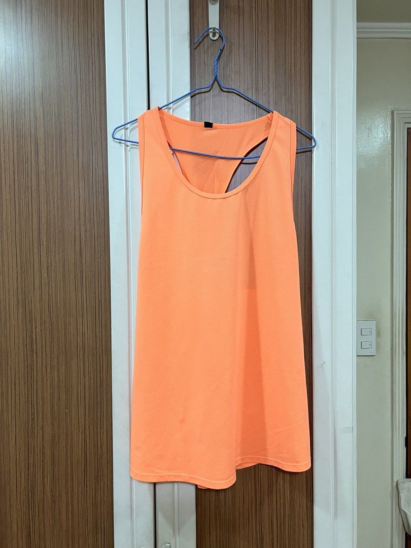 Cotton On Active Tank Top (Category: Activewear) located in Quezon City. Submitted by lightningdream (Listing ID 1424104062, Image 1). Description: Orange dri fit workout tank top from cotton on body.