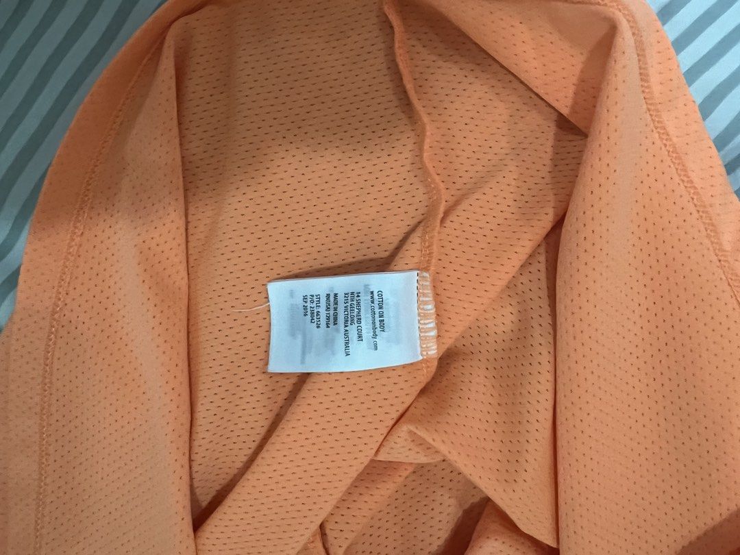 Cotton On Active Tank Top (Category: Activewear) located in Quezon City. Submitted by lightningdream (Listing ID 1424104062, Image 3). Description: Orange dri fit workout tank top from cotton on body.