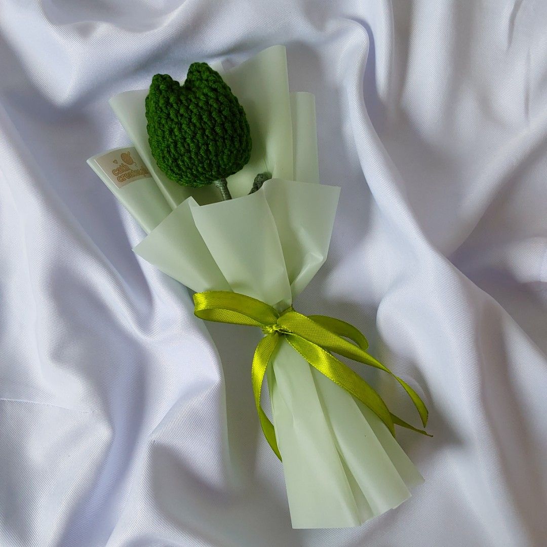 Crochet Green Tulip Bouquet (Category: Flowers & Bouquets) located in Cebu City. Submitted by starlinggg (Listing ID 1424045828, Image 1). Description: Handmade crochet tulip bouquet. The tulip is green, wrapped in light green paper and tied with a green ribbon. Perfect as a gift or for decoration. The bouquet is presented on a white satin fabric..