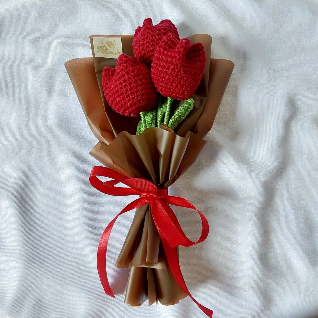 Crochet Red Tulip Bouquet (Category: Flowers & Bouquets) located in Cebu City. Submitted by starlinggg (Listing ID 1424046042, Image 1). Description: - Handmade crochet bouquet - Features three red tulips - Green stems - Wrapped in brown paper - Tied with a red ribbon - Perfect for gifting or decoration - Unique and charming.
