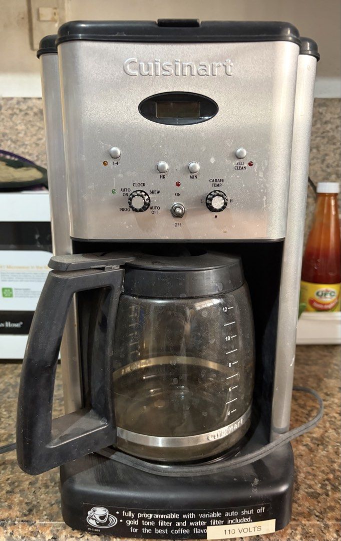 Cuisinart Coffee Maker (Category: Coffee Machines & Makers) located in San Fernando. Submitted by chicharmt14 (Listing ID 1423980882, Image 1). Description: - Cuisinart coffee maker - Programmable features - Includes gold tone filter and water filter - Features: auto shut off, clock, brew, and carafe temperature controls - 12-cup capacity - 110 volts MEET UP SAN FERNANDO PAMPANGA.
