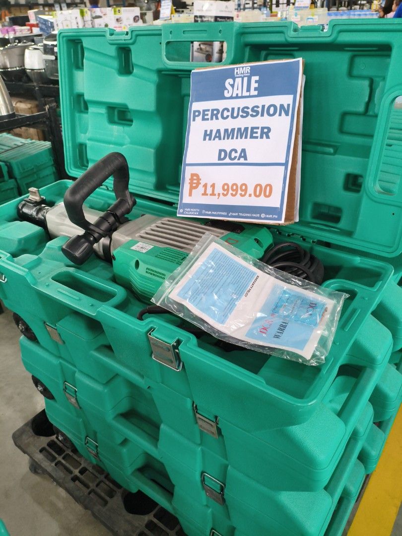 DCA Percussion Hammer (Category: Construction Tools & Equipment) located in Manila. Submitted by hmrgrace5. (Listing ID 1424010949, Image 1). Description: - DCA percussion hammer - Includes hammer and manual - Comes in original green case - Price: ₱11,999.00 - Perfect for construction and demolition projects.