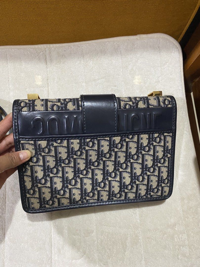 Dior MontaigneBag (Category: Luxury Bags & Wallets) located in Gattaran. Submitted by sweet_relove (Listing ID 1424117881, Image 2). Description: - Dior Montaigne Bag - Iconic Dior Oblique canvas - Navy blue leather trim - Gold-tone CD clasp - Detachable shoulder strap - Interior zip pocket - "Christian Dior Paris Made in Italy" leather tag - Serial number: 09-BO-0129.