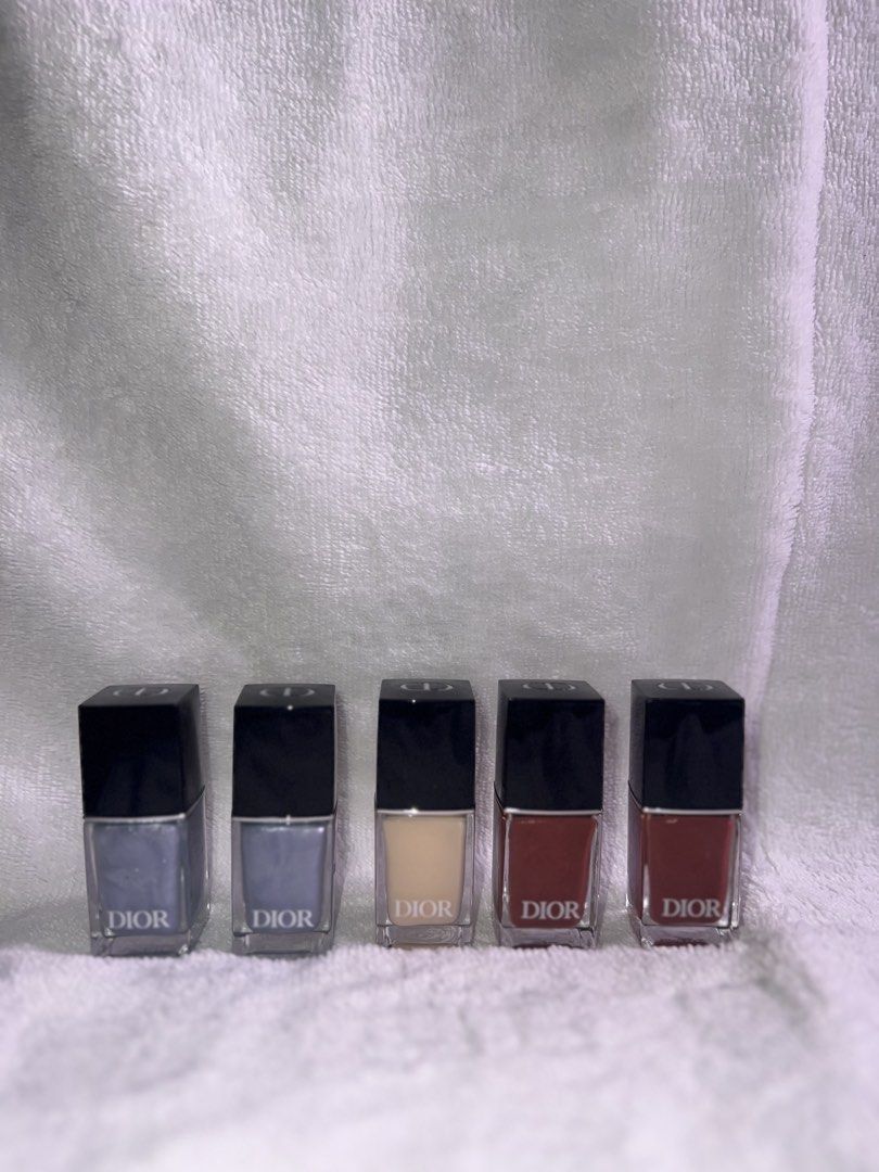 Dior Nail Polish (Category: Hands & Nails) located in Quezon City. Submitted by lalengocmp (Listing ID 1424082128, Image 2). Description: - Authentic Dior nail polish - Shades: blue, beige, and red - Each bottle features a black cap - Classic Dior logo on each bottle.