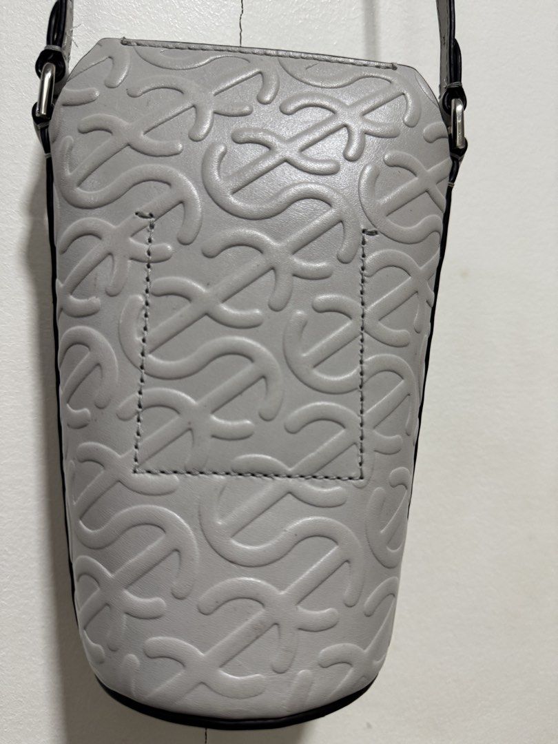 ECCO Wave Pot Leather Crossbody Bag - Grey (Category: Cross-body Bags) located in Angeles City. Submitted by asianchowqween (Listing ID 1424036512, Image 2). Description: - ECCO Wave Pot crossbody bag - Grey leather - Unique embossed pattern - Adjustable long strap - Cylindrical shape with flat bottom - Black interior - Perfect for everyday use.