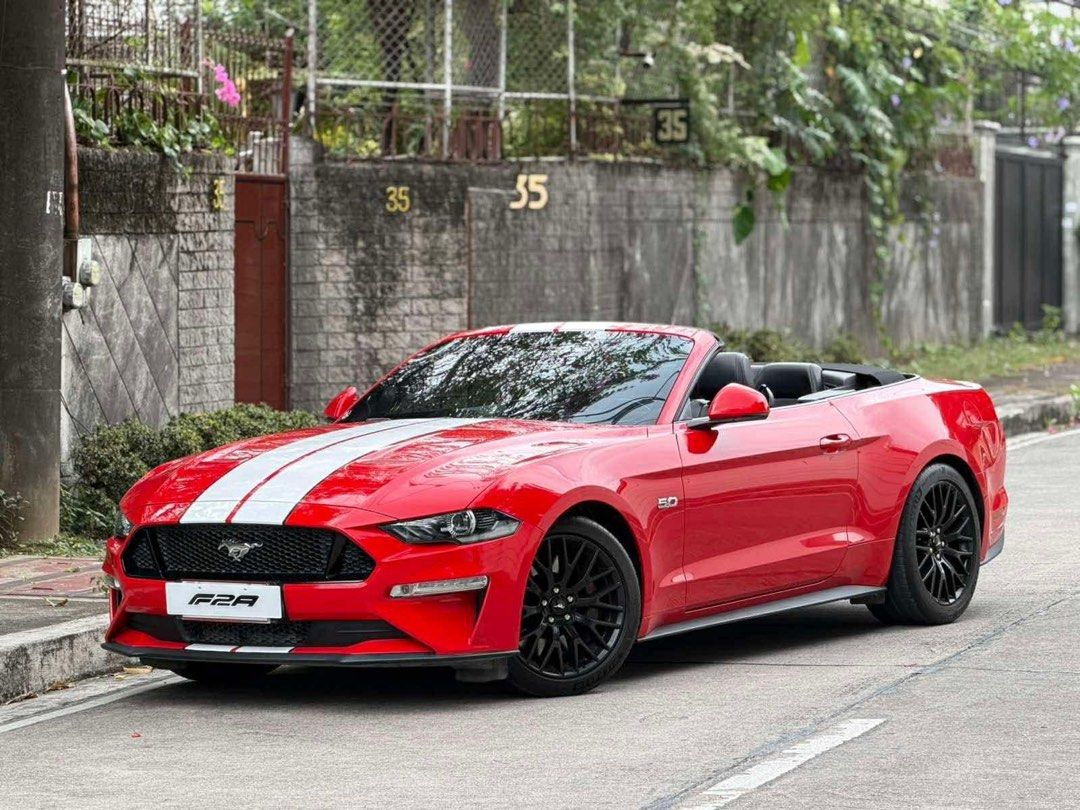 Ford Mustang 5.0 GT Auto (Category: Used Cars) located in Manila. Submitted by quality_cars (Listing ID 1424149907, Image 2). Description: ✅AVAILABLE ❗️New arrival quality unit / Fresh catch❗️ For sale : Cash , Trade in , Financing ✔️2023 acq FORD MUSTANG 5.0 GT CONVERTIBLE V8 ENGINE AUTOMATIC GASOLINE ENGINE FIRST OWNED RACE RED Original flawless paint WHITE RACING STRIPES FULL OPTIONS BORLA EXHAUST All stock , all original , all intact , pristi