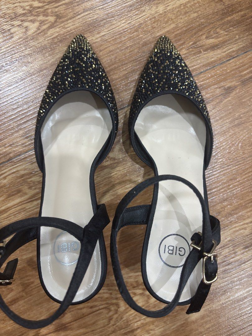 Gibi Black Heels Size 35 (Category: Heels) located in San Juan City. Submitted by ____aiceee____ (Listing ID 1424039632, Image 1). Description: Elegant black heels from Gibi, size 35. Features a pointed toe design with sparkling embellishments. Includes an ankle strap with a buckle closure. The heels have a gold-colored accent. The soles are black. The heels come with the original box. Bought for P2,199.75 / Used once .