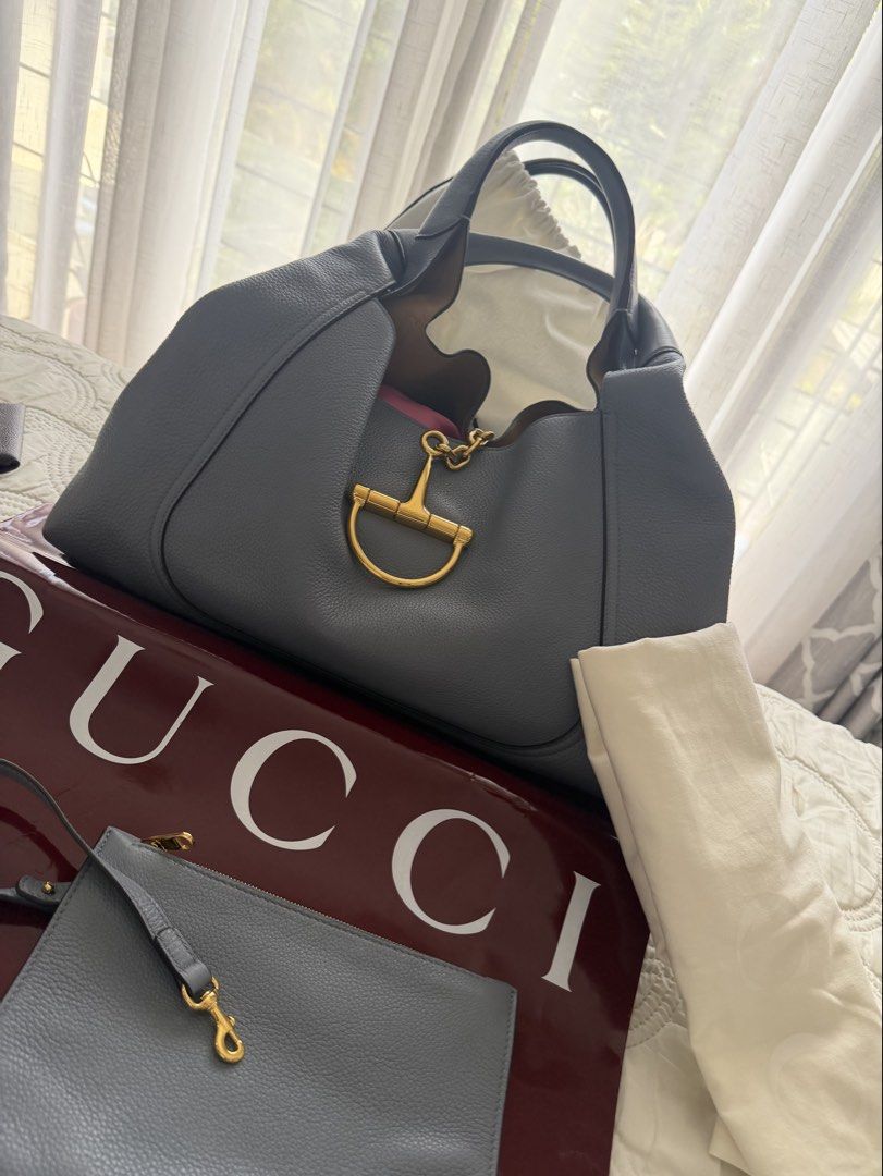 Gucci Horsebit 1955 Hobo Bag (Category: Luxury Bags & Wallets) located in Santa Rosa. Submitted by traveljewelsnbags (Listing ID 1422899232, Image 1). Description: - Authentic Gucci Horsebit 1955 Hobo Bag - Light blue leather exterior - Gold-toned chain and horsebit detail - Includes a matching pouch - Comes with authenticity cards - Presented with a Gucci shopping bag.