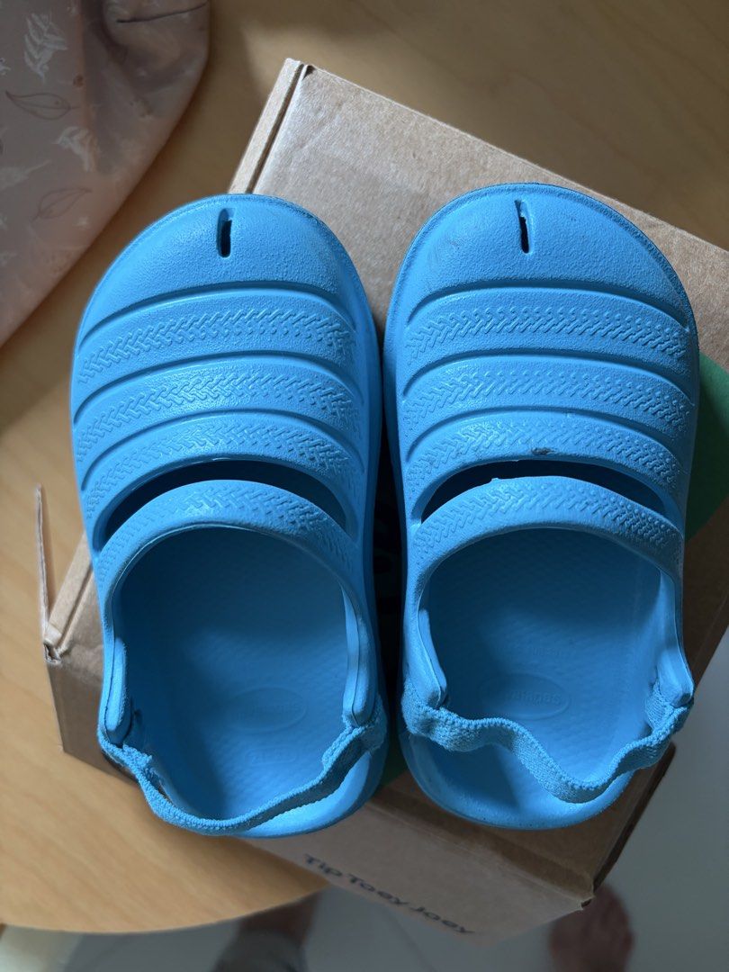 Havaianas Baby Sandals - Size 21-23 (Category: Babies & Kids Fashion) located in Singapore. Submitted by lynnoblastocyte (Listing ID 1424068165, Image 1). Description: - Light blue Havaianas baby sandals - Size: 21-23 - Condition: Good, with minimal wear - Comfortable and easy to wear with an elastic back strap.